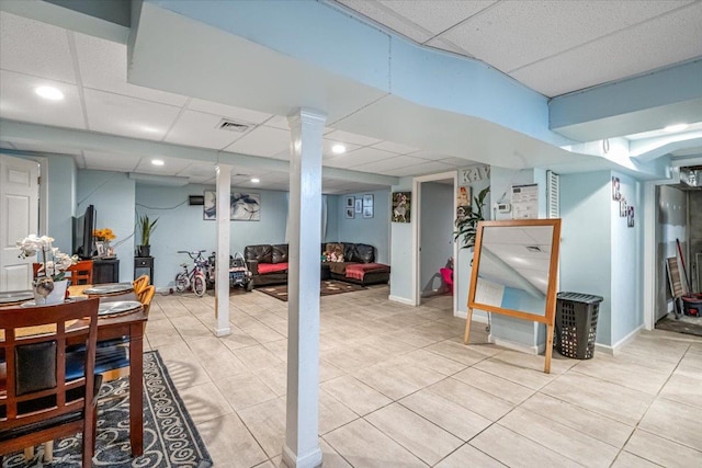 232 Courthouse Rd, Franklin Square, NY 11010 - finished basement with light tile patterned flooring, a paneled ceiling, and visible vents