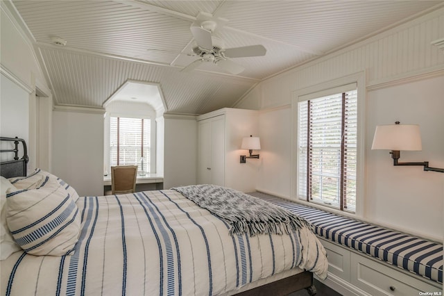 bedroom with ceiling fan and ornamental molding