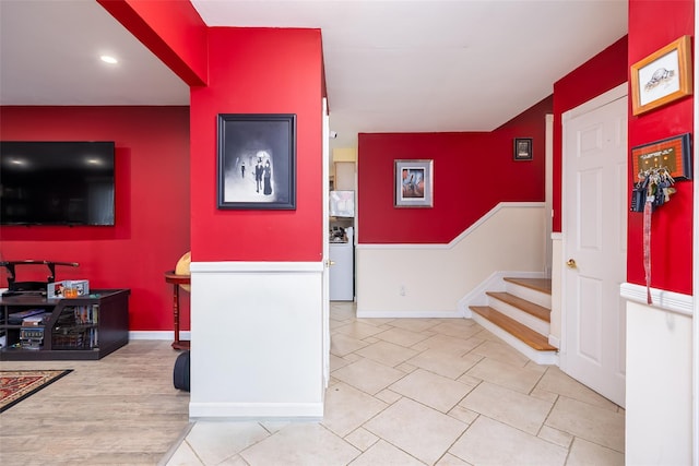 entryway with baseboards, recessed lighting, and stairs
