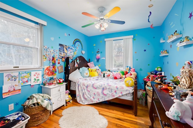 bedroom featuring wood finished floors and ceiling fan