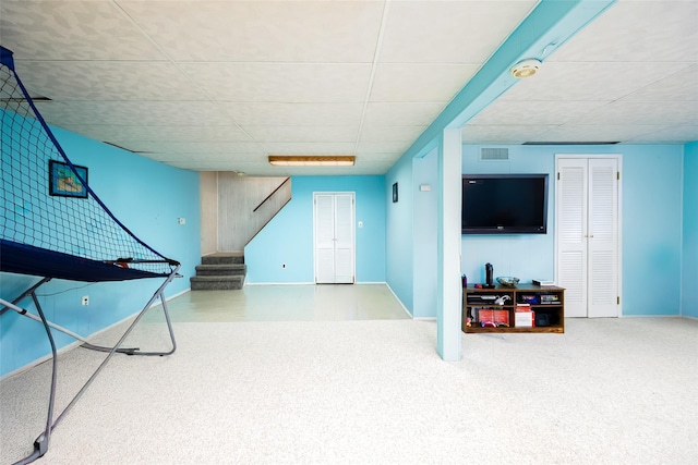 rec room featuring a paneled ceiling, baseboards, and carpet