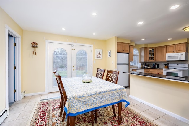 dining space with a baseboard heating unit, french doors, recessed lighting, baseboard heating, and light tile patterned floors