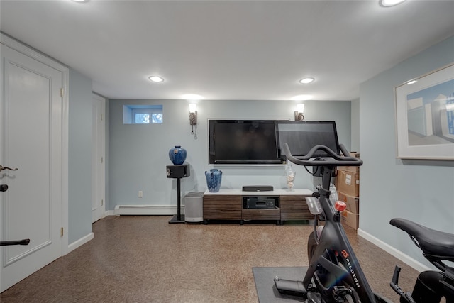 exercise area featuring a baseboard heating unit, recessed lighting, and baseboards