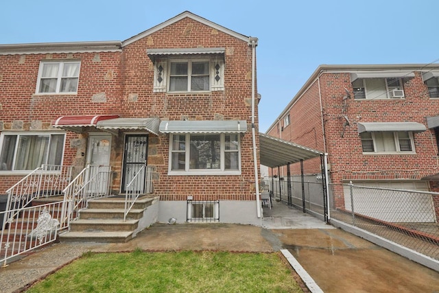 multi unit property with fence and brick siding