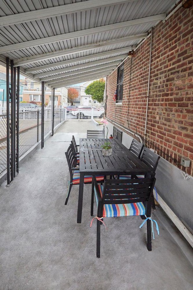 view of patio / terrace featuring fence and outdoor dining area