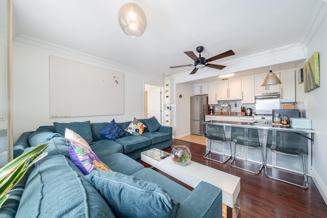49-07 43rd Ave Unit 7F, Sunnyside, NY 11377 - living area featuring dark wood finished floors, crown molding, baseboards, and a ceiling fan