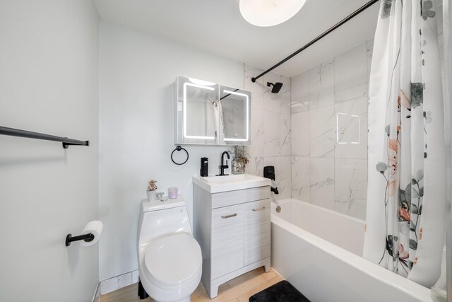 49-07 43rd Ave Unit 7F, Sunnyside, NY 11377 - bathroom with toilet, vanity, wood finished floors, and shower / bath combo with shower curtain