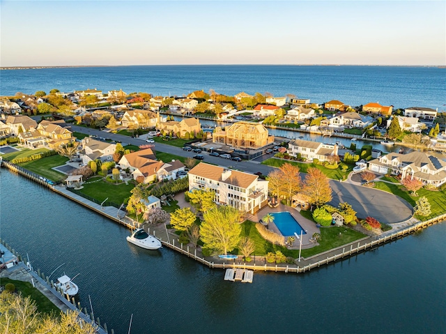 birds eye view of property featuring a water view and a residential view