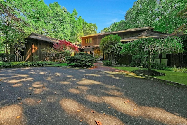 view of front of home with board and batten siding and stone siding