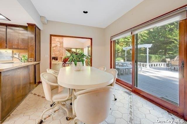 dining space with light tile patterned flooring
