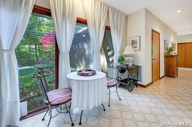 interior space with tile patterned floors and recessed lighting