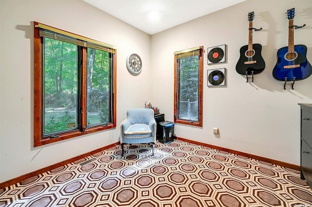sitting room featuring baseboards