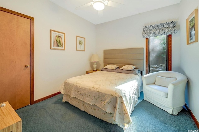 carpeted bedroom featuring baseboards and a ceiling fan