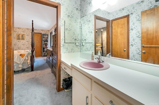 full bathroom with ensuite bath, vanity, and wallpapered walls