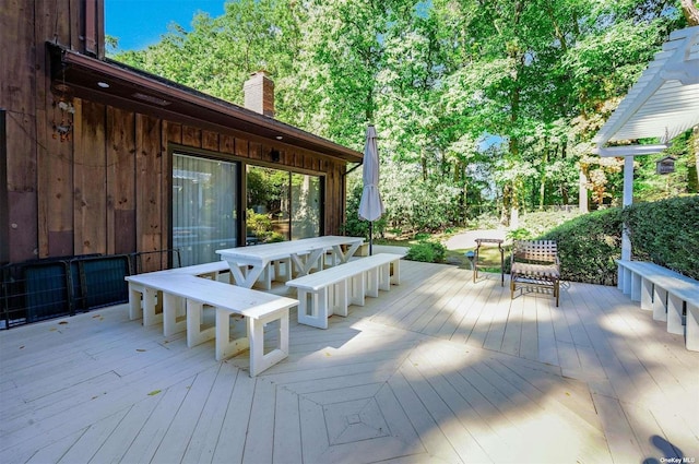 wooden deck with outdoor dining area