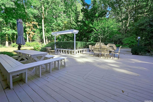 wooden deck featuring outdoor dining space