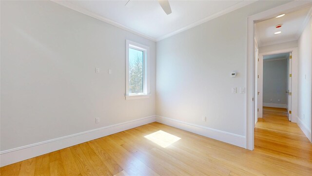 unfurnished room featuring ornamental molding, baseboards, light wood finished floors, and ceiling fan