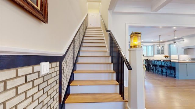 staircase featuring wood finished floors