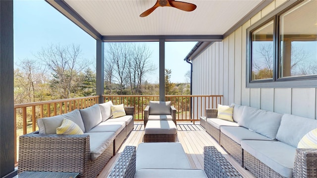 sunroom / solarium with outdoor lounge area and a ceiling fan