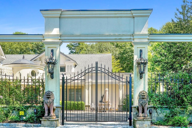 view of gate with fence