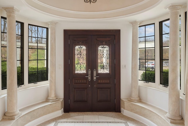 entrance to property featuring french doors and covered porch