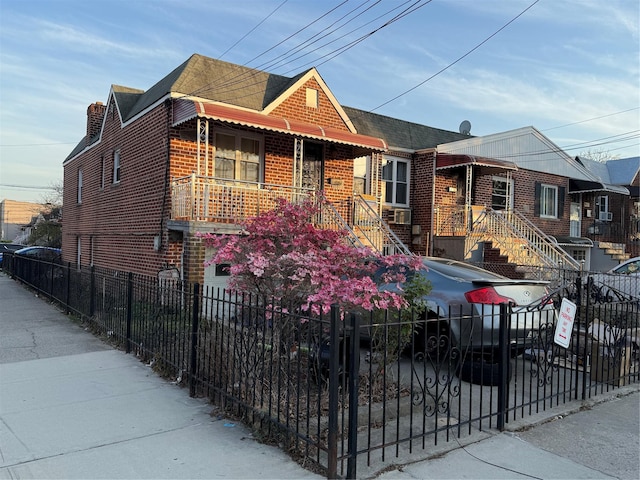 2866 Philip Ave, Bronx, NY 10465 - view of front of property featuring brick siding, a fenced front yard, and roof with shingles