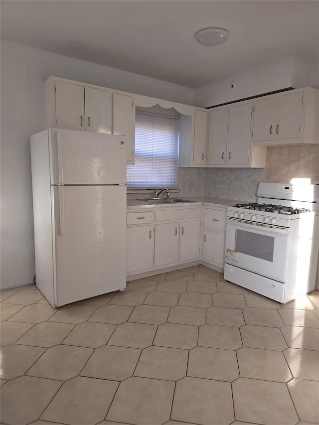 2866 Philip Ave, Bronx, NY 10465 - kitchen with white appliances, light countertops, a sink, and white cabinets