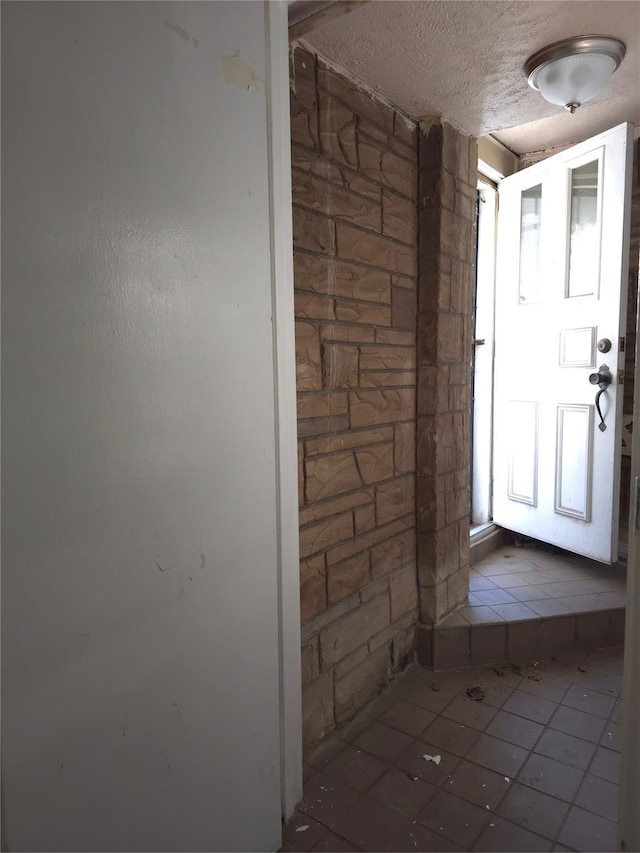 2864 Philip Ave, Bronx, NY 10465 - tiled foyer featuring a textured ceiling