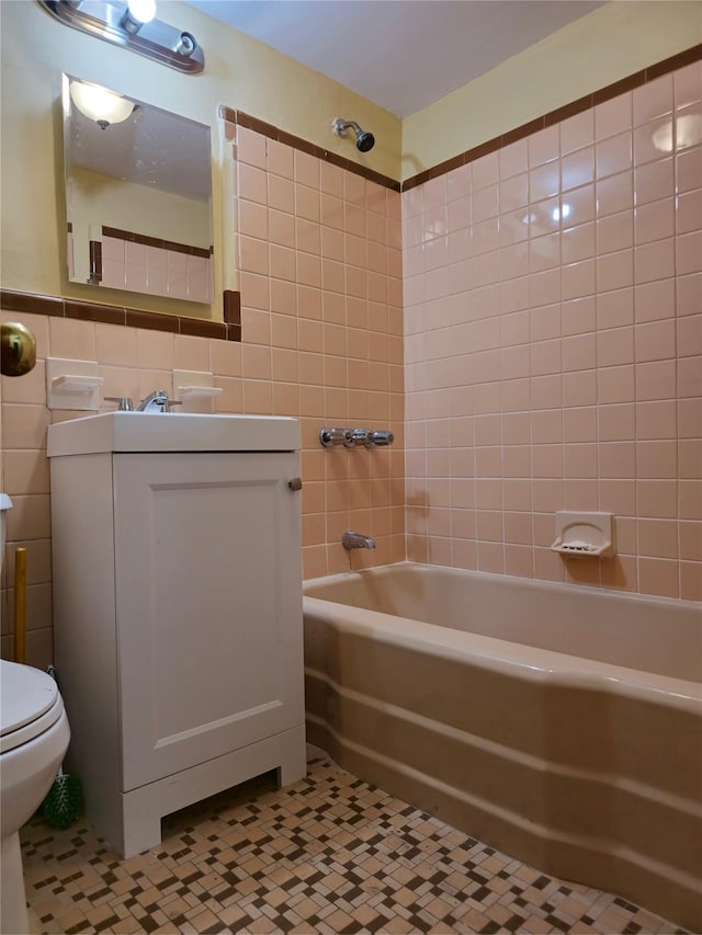 2864 Philip Ave, Bronx, NY 10465 - bathroom featuring tile walls, bathtub / shower combination, vanity, toilet, and tile patterned floors