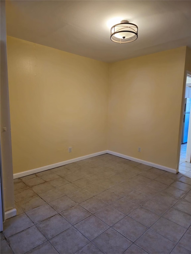 2864 Philip Ave, Bronx, NY 10465 - empty room with baseboards and dark tile patterned floors