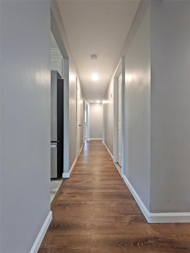 65 Biscayne Dr, Selden, NY 11784 - hallway featuring wood finished floors and baseboards