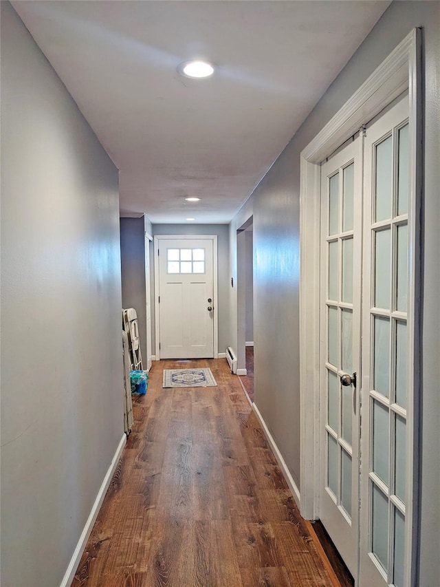 65 Biscayne Dr, Selden, NY 11784 - doorway with wood finished floors, baseboards, baseboard heating, and recessed lighting