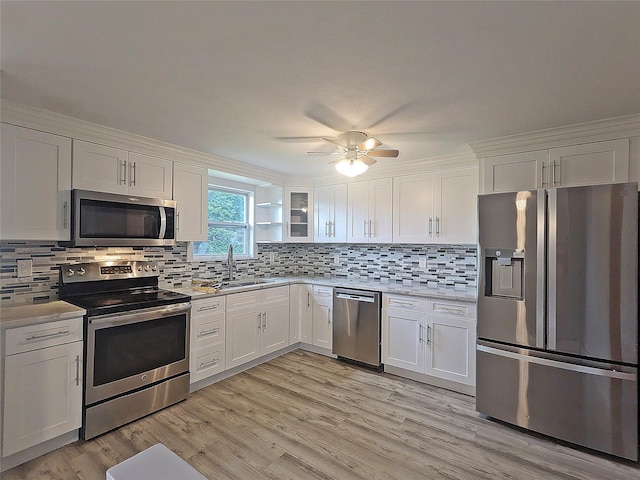 65 Biscayne Dr, Selden, NY 11784 - kitchen with appliances with stainless steel finishes, a sink, light countertops, and white cabinets