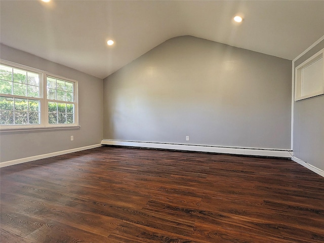 65 Biscayne Dr, Selden, NY 11784 - unfurnished room with a baseboard heating unit, vaulted ceiling, dark wood-style floors, recessed lighting, and baseboards