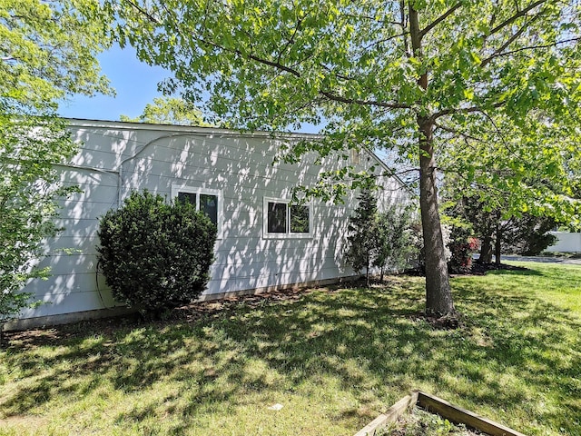 65 Biscayne Dr, Selden, NY 11784 - view of home's exterior featuring a yard