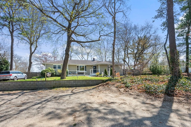 view of front of property featuring fence