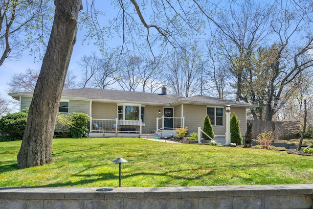 single story home with a front lawn, a chimney, and fence