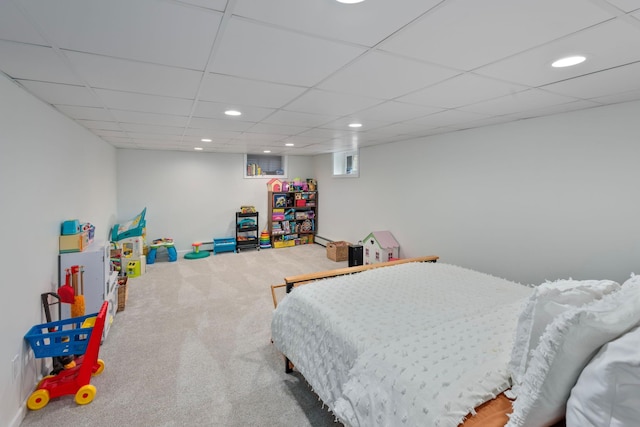 bedroom with recessed lighting, carpet, and a paneled ceiling