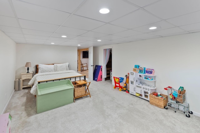 carpeted bedroom featuring recessed lighting, a drop ceiling, and baseboards