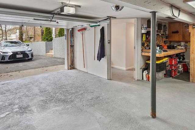 garage featuring a workshop area and a garage door opener