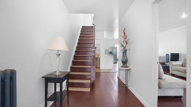 150-31 Hoover Ave, Briarwood, NY 11432 - stairway featuring radiator and wood finished floors