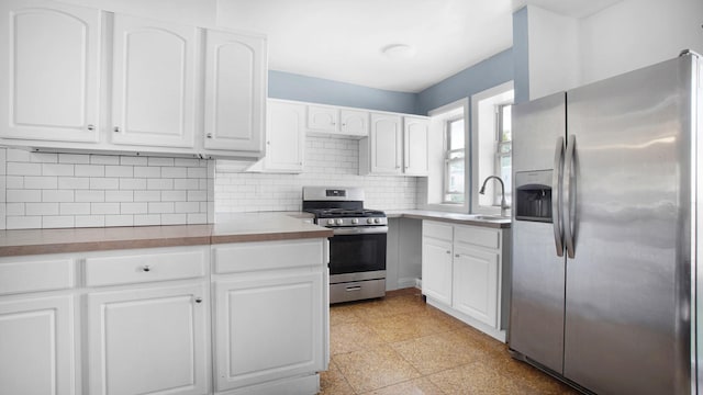 150-31 Hoover Ave, Briarwood, NY 11432 - kitchen with stainless steel appliances and white cabinetry