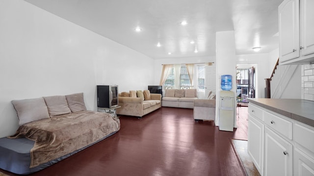 150-31 Hoover Ave, Briarwood, NY 11432 - living room featuring dark wood-type flooring, recessed lighting, and stairs