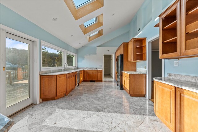 46 Mount Grey Rd, Setauket, NY 11733 - kitchen with a skylight, open shelves, brown cabinetry, light marble finish flooring, and freestanding refrigerator