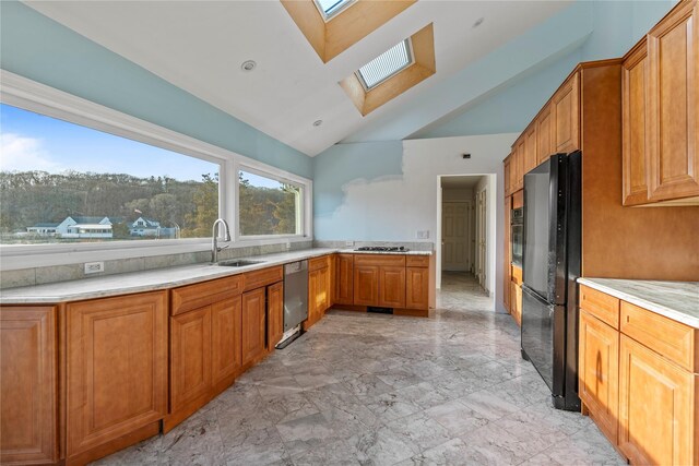 46 Mount Grey Rd, Setauket, NY 11733 - kitchen with a skylight, freestanding refrigerator, stainless steel dishwasher, a sink, and light countertops
