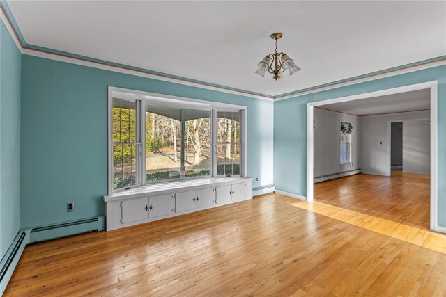 46 Mount Grey Rd, Setauket, NY 11733 - unfurnished dining area with a baseboard heating unit, a chandelier, and ornamental molding