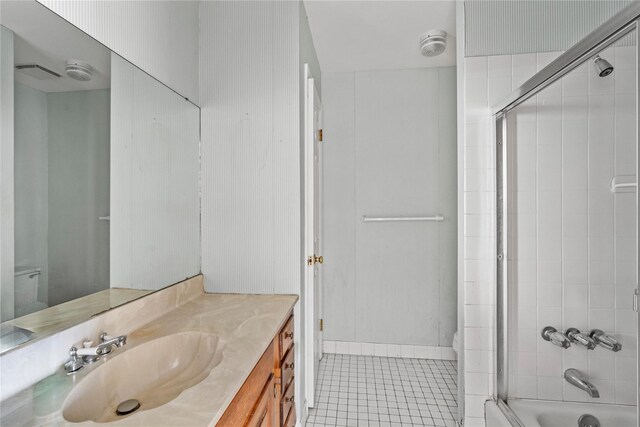 46 Mount Grey Rd, Setauket, NY 11733 - full bath featuring tile patterned flooring, vanity, combined bath / shower with glass door, and toilet