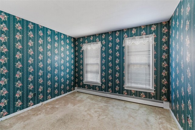 46 Mount Grey Rd, Setauket, NY 11733 - unfurnished room with baseboard heating, carpet, and baseboards