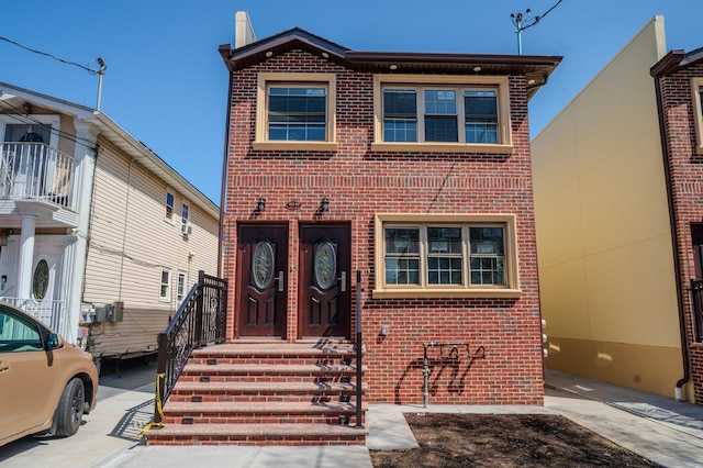 view of front facade featuring brick siding