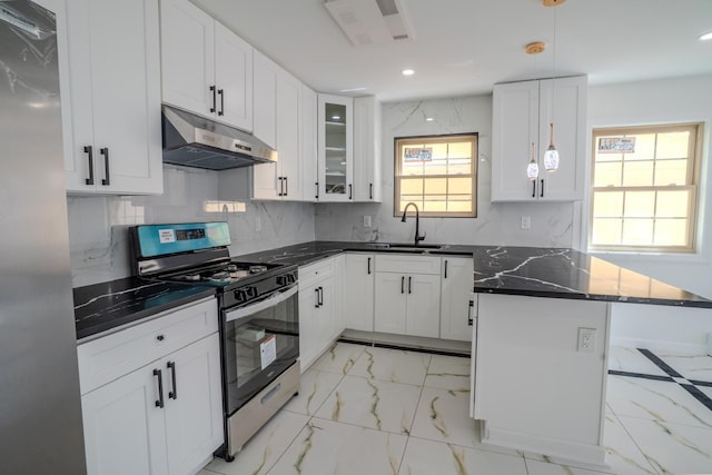 kitchen with white cabinets, a peninsula, under cabinet range hood, stainless steel appliances, and marble finish floor